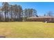 Beautifully maintained backyard showcasing a classic brick home with an inviting deck at 275 S Bethany Rd, Mcdonough, GA 30252