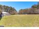 Expansive backyard with mature trees, offering a private and serene outdoor space at 275 S Bethany Rd, Mcdonough, GA 30252