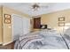 Bedroom featuring a white closet door, ceiling fan, and neutral decor, creating a cozy atmosphere at 275 S Bethany Rd, Mcdonough, GA 30252