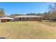 Charming ranch-style brick home with a spacious front yard and mature trees at 275 S Bethany Rd, Mcdonough, GA 30252