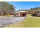 Detached two car garage featuring an attached workshop and long driveway at 275 S Bethany Rd, Mcdonough, GA 30252