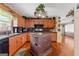 Well-lit kitchen features an island, granite countertops and stainless steel appliances at 275 S Bethany Rd, Mcdonough, GA 30252