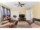 Cozy living room featuring hardwood floors, ceiling fan and a neutral color palette at 275 S Bethany Rd, Mcdonough, GA 30252