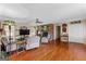 Spacious living room with hardwood floors and a brick fireplace at 275 S Bethany Rd, Mcdonough, GA 30252