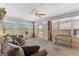 Bright sunroom with lots of natural light, cozy seating, and views of the outdoor greenery at 275 S Bethany Rd, Mcdonough, GA 30252