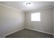 Cozy bedroom featuring neutral paint and carpet with a bright window at 1751 Woodsloe Dr, Decatur, GA 30035
