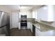 Well-equipped kitchen featuring stainless steel appliances and granite countertops at 1751 Woodsloe Dr, Decatur, GA 30035