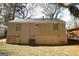 Back exterior of home, featuring sturdy construction and a well-kept lawn at 2096 Dellwood Pl, Decatur, GA 30032