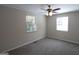 Spacious bedroom featuring neutral paint, plush carpet, and natural light from two windows at 2096 Dellwood Pl, Decatur, GA 30032