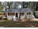 Charming brick home featuring a welcoming front entrance and meticulously maintained landscaping at 2096 Dellwood Pl, Decatur, GA 30032