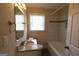Cozy full bath with single sink vanity and shower-tub combo at 2823 Horse Shoe Dr, Atlanta, GA 30316
