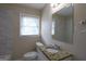 Bathroom featuring granite countertop, updated fixtures, and neutral tile at 3065 Glendale Ct, Decatur, GA 30032