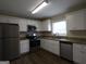 Well-lit kitchen with stainless steel appliances, granite countertops, and white cabinets at 3065 Glendale Ct, Decatur, GA 30032