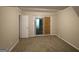 Bedroom featuring carpet, windows, sliding glass door, and neutral walls at 4044 Lindsey Dr, Decatur, GA 30035