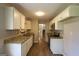 Renovated kitchen with granite countertops, white cabinets, and stainless steel appliances at 4044 Lindsey Dr, Decatur, GA 30035