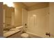 Bathroom featuring a granite vanity top, a combined shower and tub with tile surround, and neutral tones at 767 San Miguel Dr, Stone Mountain, GA 30083