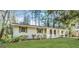 Charming ranch-style home featuring a white brick exterior, well-maintained lawn, and mature trees providing shade at 767 San Miguel Dr, Stone Mountain, GA 30083