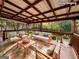 Virtual staging of an outdoor deck with patio furniture and a view of the backyard at 1351 John Robert Dr, Morrow, GA 30260