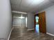 Open basement area with painted walls, drop ceiling and vinyl flooring at 1351 John Robert Dr, Morrow, GA 30260