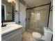 Bathroom boasts a glass shower, stylish fixtures, and a bright, clean aesthetic at 1351 John Robert Dr, Morrow, GA 30260