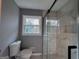 Bright bathroom featuring a glass shower and a view from the window at 1351 John Robert Dr, Morrow, GA 30260