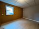 Bedroom featuring neutral walls, wood-look paneling and a view to the outside at 1351 John Robert Dr, Morrow, GA 30260