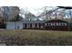 Lovely brick ranch home with white trim, covered porch, and mature trees at 1351 John Robert Dr, Morrow, GA 30260