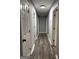 Long hallway with wood floors, white trim, and neutral paint color at 1351 John Robert Dr, Morrow, GA 30260