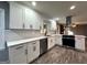 Updated kitchen with white shaker cabinets, quartz countertops, subway tile backsplash, and new appliances at 1351 John Robert Dr, Morrow, GA 30260