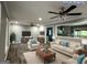 Virtual staging of a living room with wood floors, neutral furniture, and open layout at 1351 John Robert Dr, Morrow, GA 30260