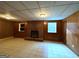 Spacious living room featuring a brick fireplace, tile floors, and neutral walls at 1351 John Robert Dr, Morrow, GA 30260