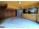Open living space showcasing tile floors and a pass-through to an updated kitchen at 1351 John Robert Dr, Morrow, GA 30260