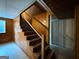 Basement staircase featuring wood paneling and tile flooring at 1351 John Robert Dr, Morrow, GA 30260