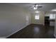 Spacious living area featuring dark hardwood floors and modern ceiling fan at 3037 San Juan Dr, Decatur, GA 30032