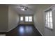 Bright living space showcasing dark floors, natural light, and fresh paint at 3037 San Juan Dr, Decatur, GA 30032