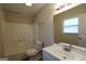 Well-lit bathroom with a white vanity and a tub-shower combination at 756 Sugar Hill Ln, Conyers, GA 30094