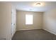 Simple bedroom offering soft carpeting and a sunlit window at 756 Sugar Hill Ln, Conyers, GA 30094