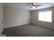 Comfortable bedroom with a ceiling fan and a window providing natural light at 756 Sugar Hill Ln, Conyers, GA 30094