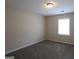 Cozy bedroom featuring plush carpet and a bright window at 756 Sugar Hill Ln, Conyers, GA 30094