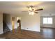 Bright living room featuring new flooring and a modern ceiling fan at 756 Sugar Hill Ln, Conyers, GA 30094
