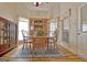 Dining room with wood table, chairs, and display cabinet, lit by a ceiling fan at 170 Habersham Dr, Fayetteville, GA 30214