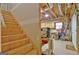 Stairway leading to unfinished basement workshop with exposed rafters and walls at 315 Antebellum Way, Fayetteville, GA 30215