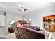 Spacious living room featuring a comfortable leather couch and entertainment center at 315 Antebellum Way, Fayetteville, GA 30215