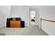 Well lit loft space with light gray carpet and a classic wood dresser and stereo equipment at 315 Antebellum Way, Fayetteville, GA 30215