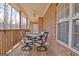 Covered patio with wooden floors and outdoor dining set at 315 Antebellum Way, Fayetteville, GA 30215