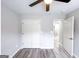 Neutral bedroom with light gray paint and vinyl floors and an open closet at 102 Neal Ave, Stockbridge, GA 30281