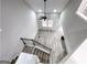 Staircase featuring dark wood and light wood floors, and a black ceiling fan at 102 Neal Ave, Stockbridge, GA 30281