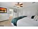 Bedroom with carpet, ceiling fan, dresser, window and a door leading to bath at 676 Mcbride Rd, Fayetteville, GA 30215