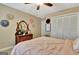 Bedroom with a bed made with peach bedding, closet and dresser at 676 Mcbride Rd, Fayetteville, GA 30215