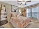 Bedroom with a bed made with peach bedding, a ceiling fan and decor at 676 Mcbride Rd, Fayetteville, GA 30215